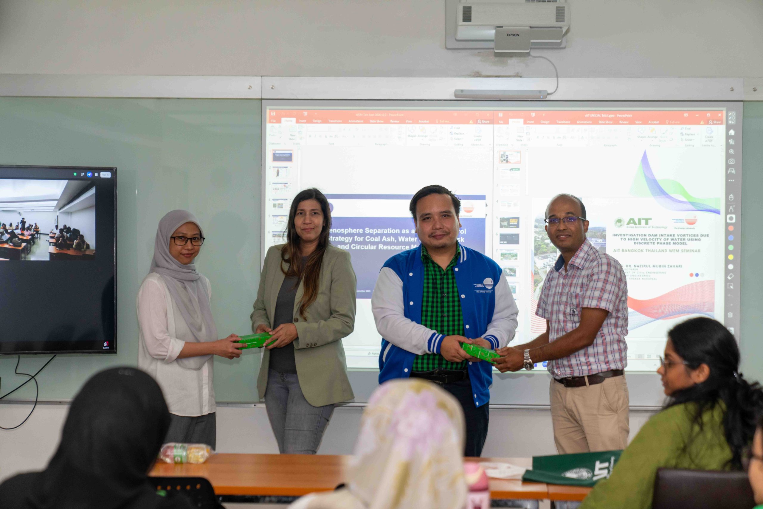 Dr. Dibesh and Dr. Nurul presenting token of appreciation to UNITEN